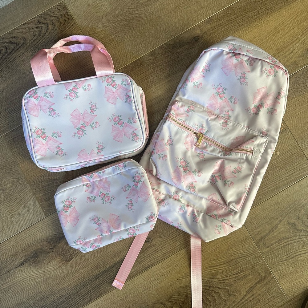 Love shack fancy-ish size M pink floral backpack, pencil case, and lunch bag.
